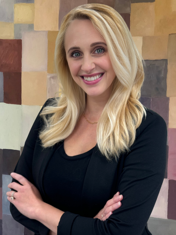 Rebecca Headshot w Painting_2025