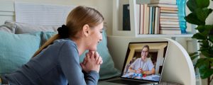Teenager girl having online video conference therapy with psychologist therapist counselor. Mental health of adolescence youth, professional support, psychology psychotherapy counseling technology
